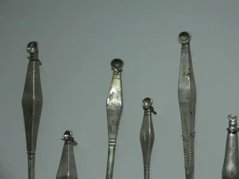 Metal ear picks with a shape resembling a diamond